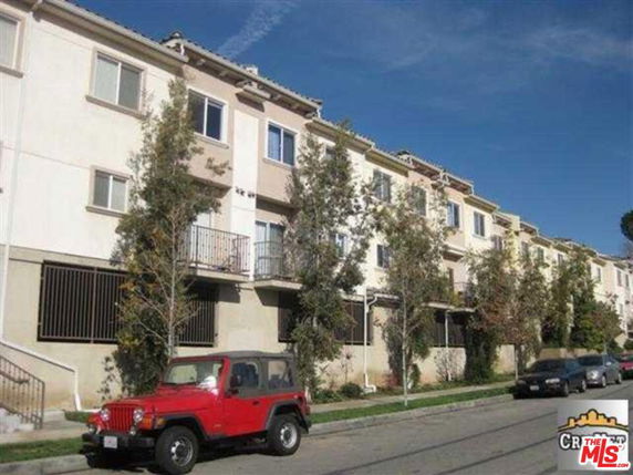 Front view of a multi-story apartment building.
