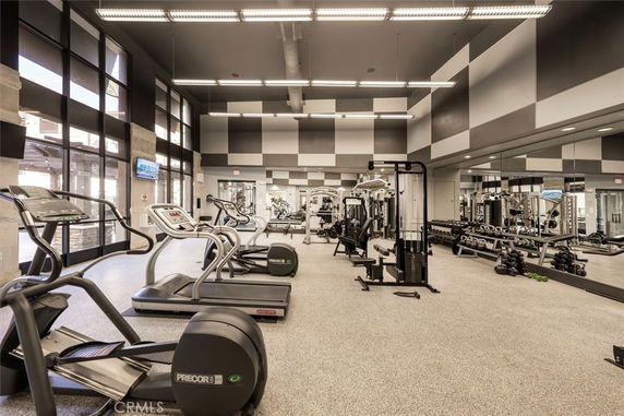 Interior view of a gym with various exercise equipment.