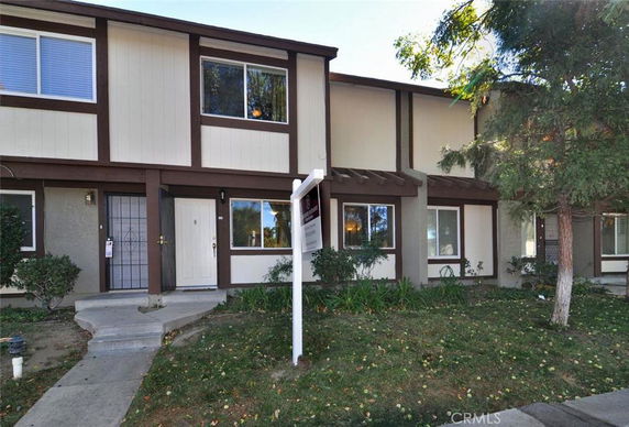 Front view of a two-story townhouse complex.