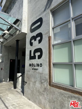 Front view of a building with the address 530 Molino Street