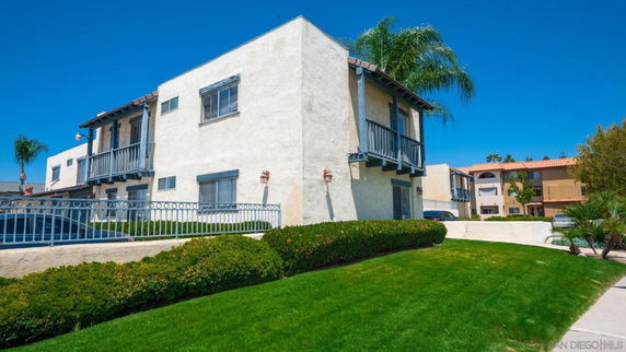 Front view of a two-story residential building with balconies.