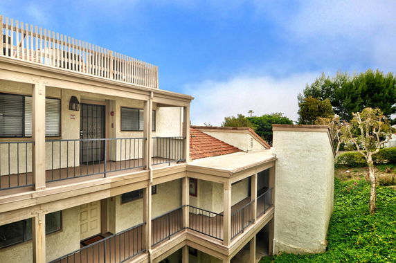 View of a multi-level residential building exterior.