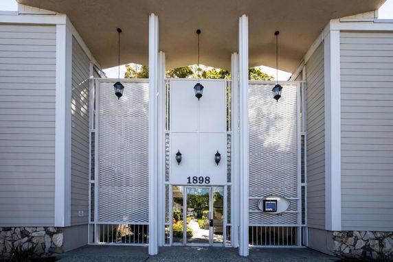 Front view of a building with a prominent modern architectural design.