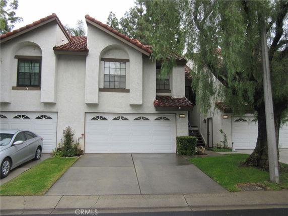Front view of a two-story house with attached garages.