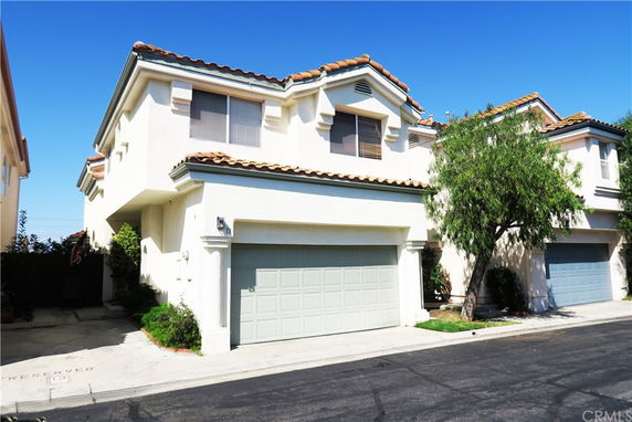 Front view of a two-story house with a double garage.