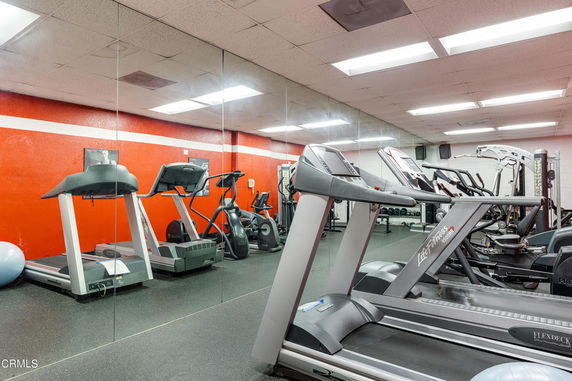 Indoor gym area with treadmills and exercise equipment.