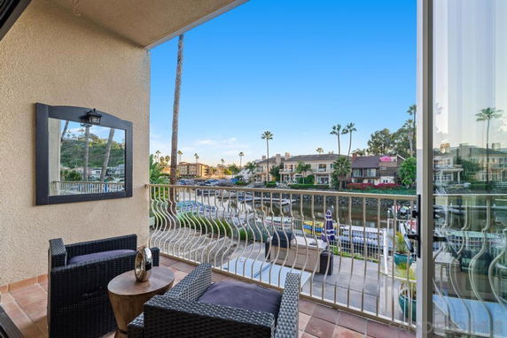 View of surrounding residential area with canal from a balcony.