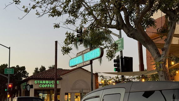 Street view featuring a Starbucks Coffee building and a 'Normal Heights' sign.