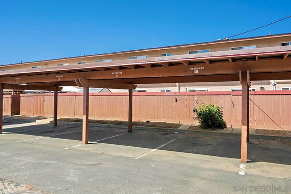 Covered parking area with reserved parking spaces.