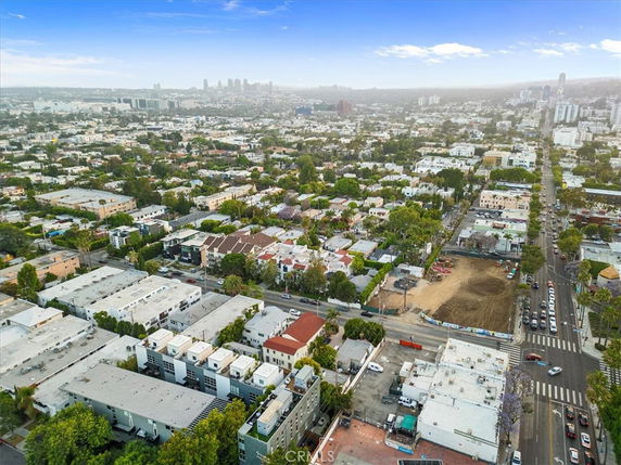 Wide angle aerial view of an urban area with numerous buildings and streets.
