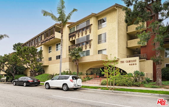Front view of a multi-story residential building named The Camelot.