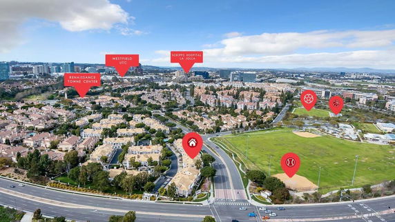 Panoramic aerial view of residential area with landmarks indicated.