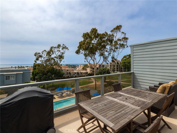 Panoramic view from a balcony with outdoor seating.