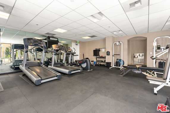 Indoor gym area with treadmills and exercise equipment.