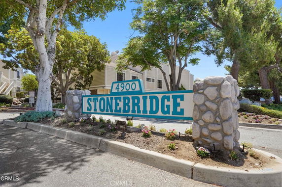 Front view of a residential complex with a prominent entrance sign marked 'Stonebridge'.