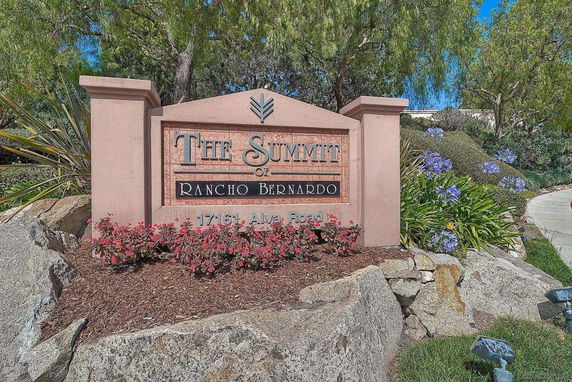 Entrance sign for The Summit of Rancho Bernardo with surrounding landscaping.