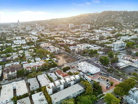 Panoramic view of a cityscape with buildings and streets.