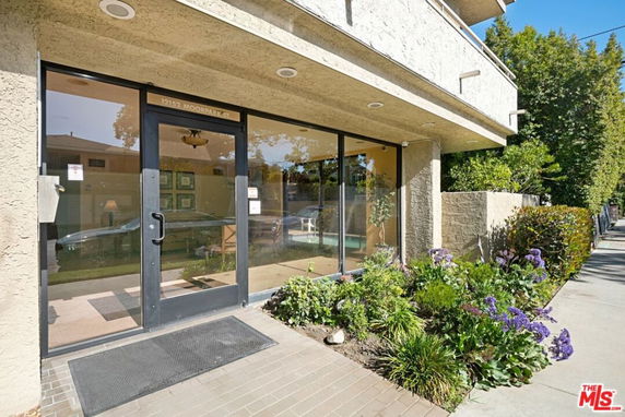 Front view of a building with glass entrance doors.