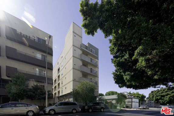 Front view of a multi-story building with a modern design.