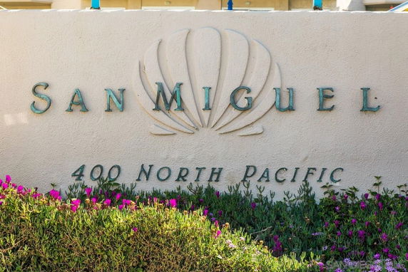 Front view of a building with 'San Miguel' signage and address '400 North Pacific'.