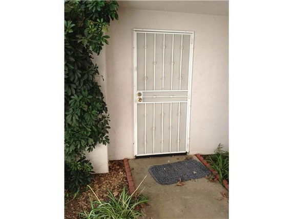 Front view of a building entrance with a security door.