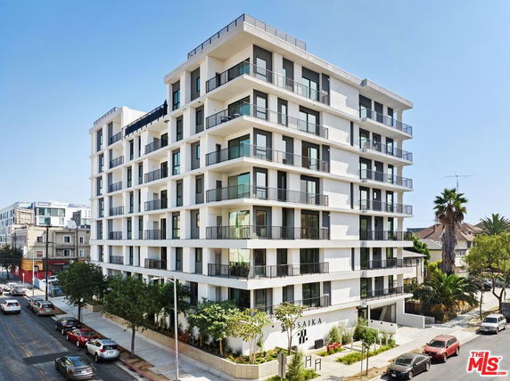 Front view of a modern multi-story apartment building.