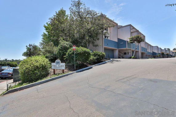 Front view of a multi-story condominium complex titled 'The Park Condominiums'.