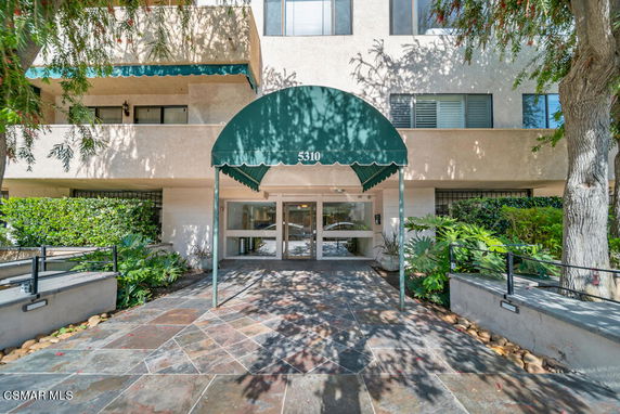 Front view of a building with an entrance awning.