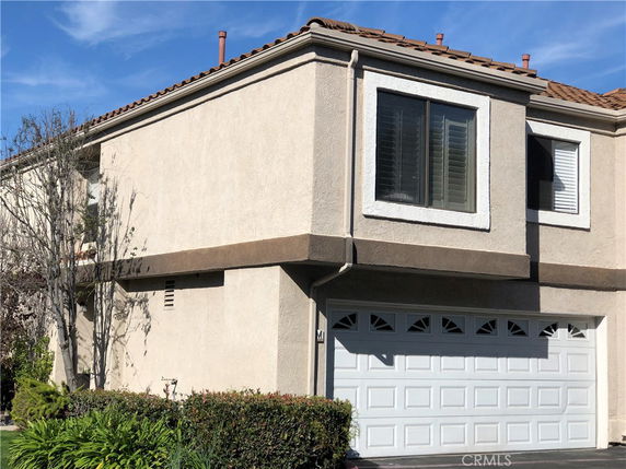 Front view of a house with an attached double garage.