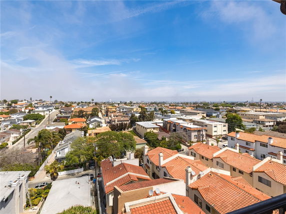 Panoramic view of a residential area with multiple houses and buildings.
