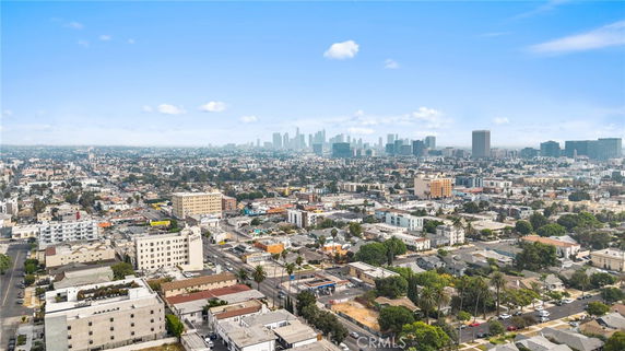 Panoramic view of a cityscape with buildings and a distant skyline.