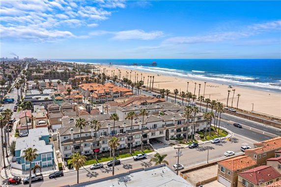 Panoramic view of a coastal neighborhood with beach and ocean.