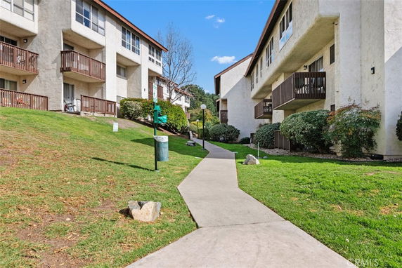 Elevated view of a residential building with balconies.