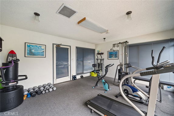 Indoor gym area with exercise equipment.
