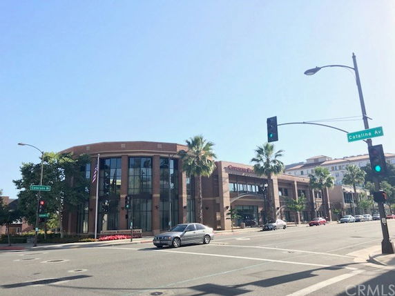 Front view of a commercial building with multiple floors.