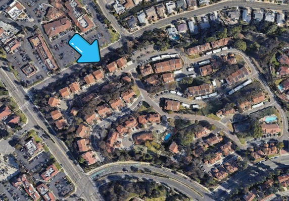 Aerial view of a residential area with multiple buildings and streets.