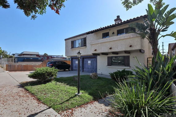 Front view of a two-story house with a double garage.