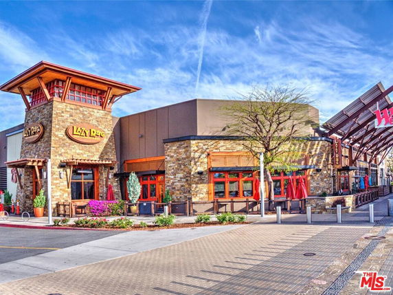 Front view of a commercial building with stone and wood accents