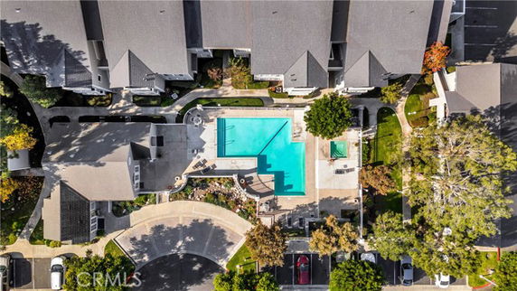 Aerial view of a residential complex with a central swimming pool area.