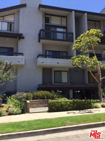 Front view of a multi-story apartment building.