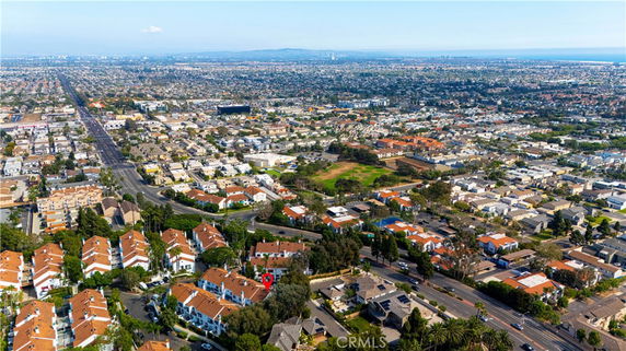 Aerial view of a vast suburban area with numerous houses and buildings.