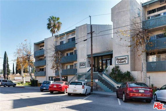 Front view of a multi-story apartment building named Regent Court.