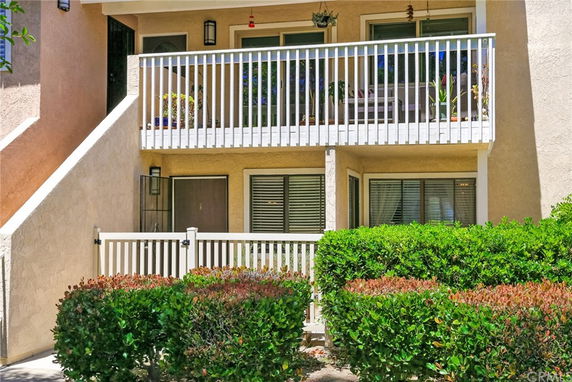 Front view of a multi-story building with balconies.