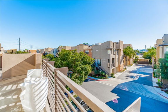 View from a building looking out over a residential area with multiple townhouses.
