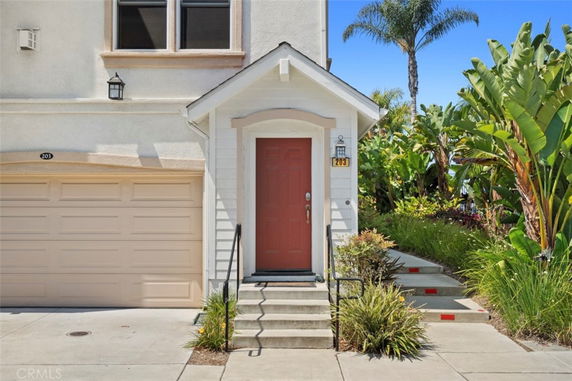 Front view of a house with a garage and entryway.
