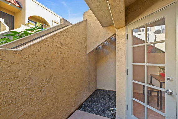 Exterior view of a building entrance with a glass door.