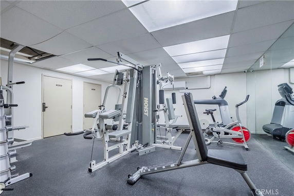 Indoor gym area with various exercise equipment.