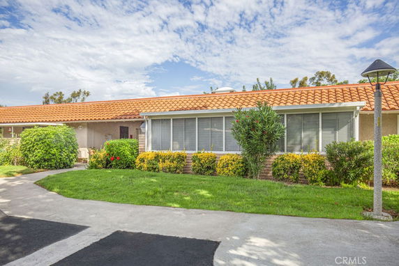 Front view of a single-story house with a tile roof.