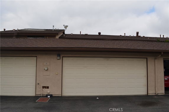 Front view of a building with double garage doors