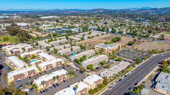 Panoramic view of a residential area with multiple buildings and roads.